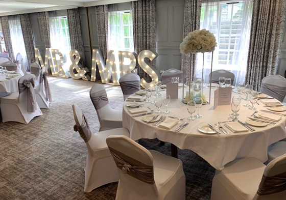 Meal set up with Mr & Mrs signage in background